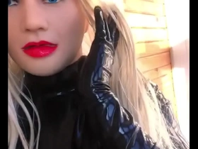 Latex barbie crossdresser enjoys the sunshine