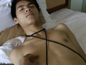 Gay bondage and handjob with an Asian boy